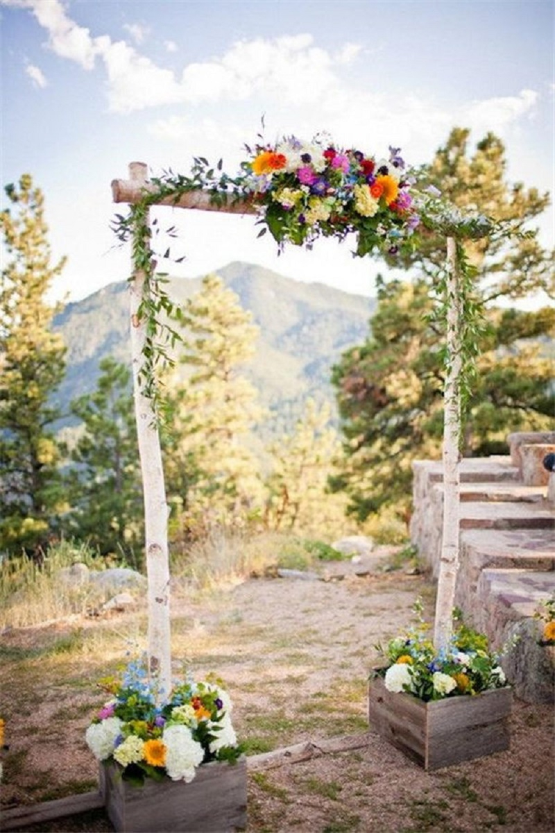 Beautiful birch poles create a gorgeous rustic wedding arch