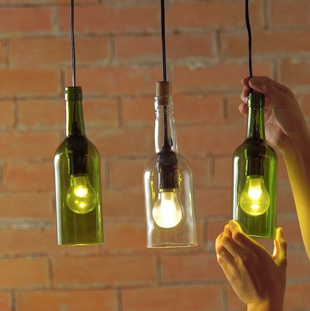 Repurpose a wine bottle into a hanging light Unexpectedly Aesthetic DIY Wine Bottle Crafts That Magically Shining