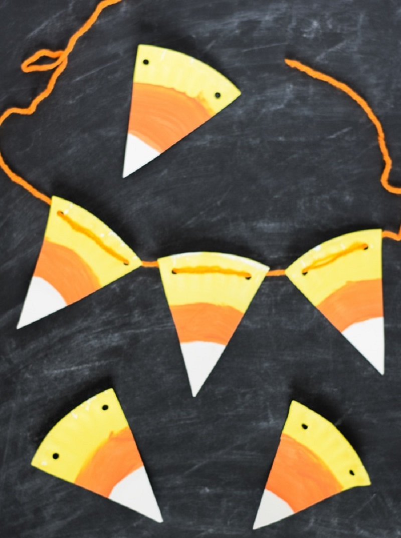 Candy corn bunting Indescribable DIY Paper Plate Crafts To Complete Your Halloween Celebration