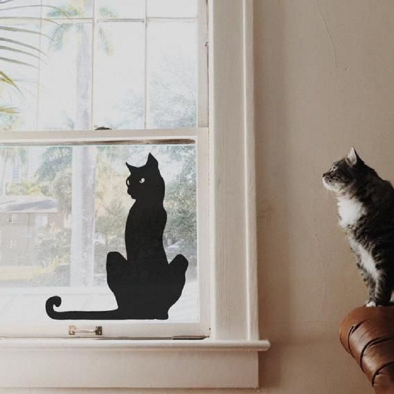 Window decoration with black cat