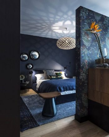 Dark and moody bedroom with navy