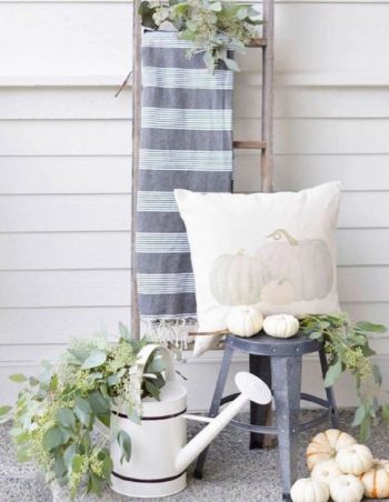 Neutral fall decor with a ladder