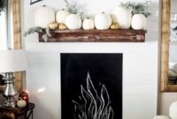 Improve mantel decor with pumpkins