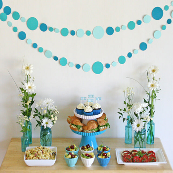 Paper garland over flowers feast Cutest DIY Baby Shower Decorations That Will Make Everybody Smile