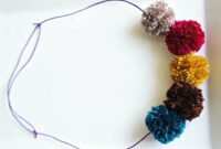 Diy sparkly pom poms on a slip necklace