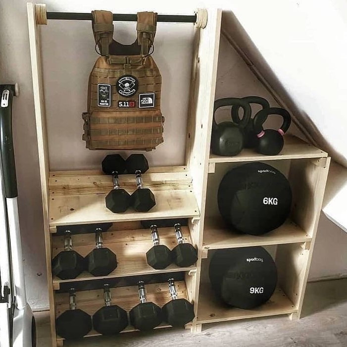 The storage is in the form of a cabinet rack with hooks to hang gym equipment.