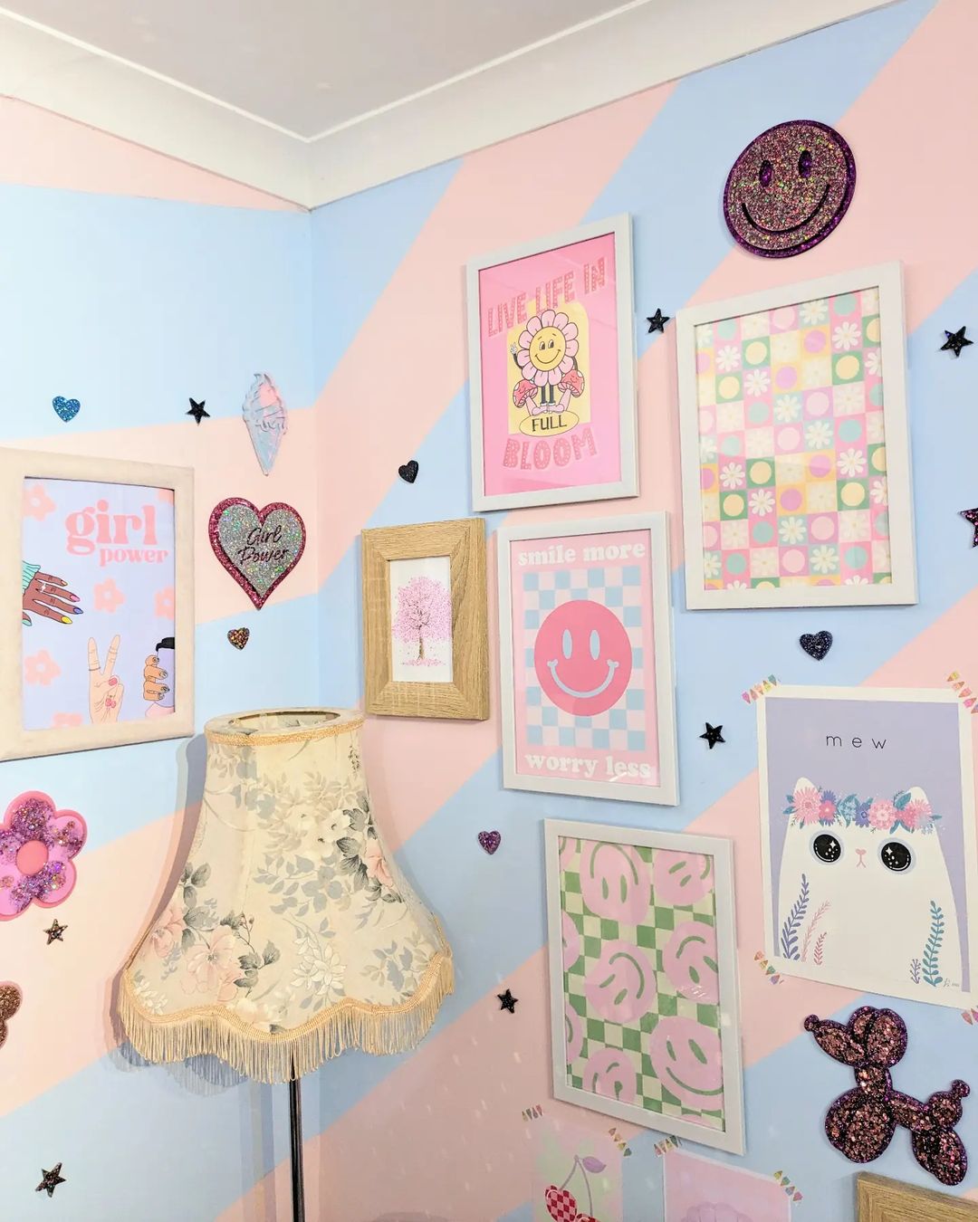 The prints that are framed for this wall gallery are so cute. It has an animal theme, a smile emoticon theme, a floral, and a girly theme. 